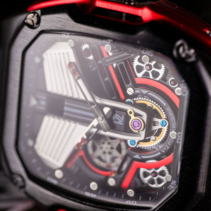 Close-up of a HMN V12 Cullinan mechanical watch with intricate gears and red accents.